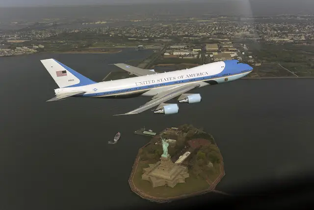 Photograph of Air Force One flying over the Statue of Liberty from the White House